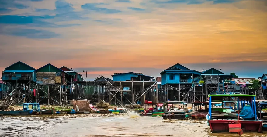 Kompong Phluk stilt house floating village at sunset on Tonle Sap Lake Siem Reap